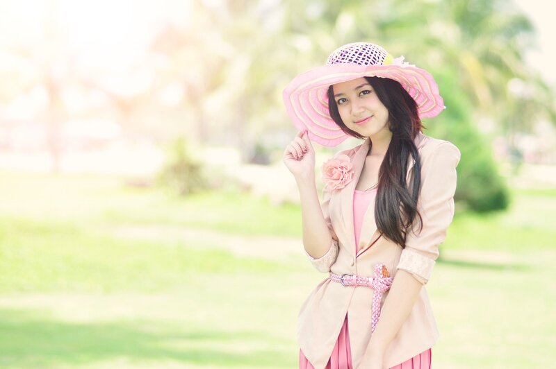 woman in pink hat outdoors