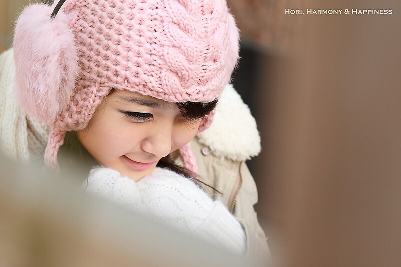 woman in pink hat smiling