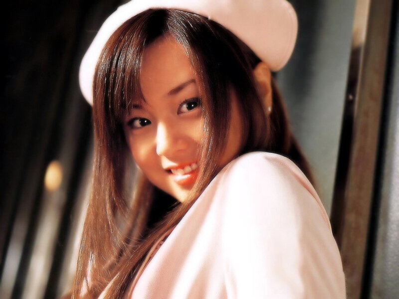 woman in pink hat smiling