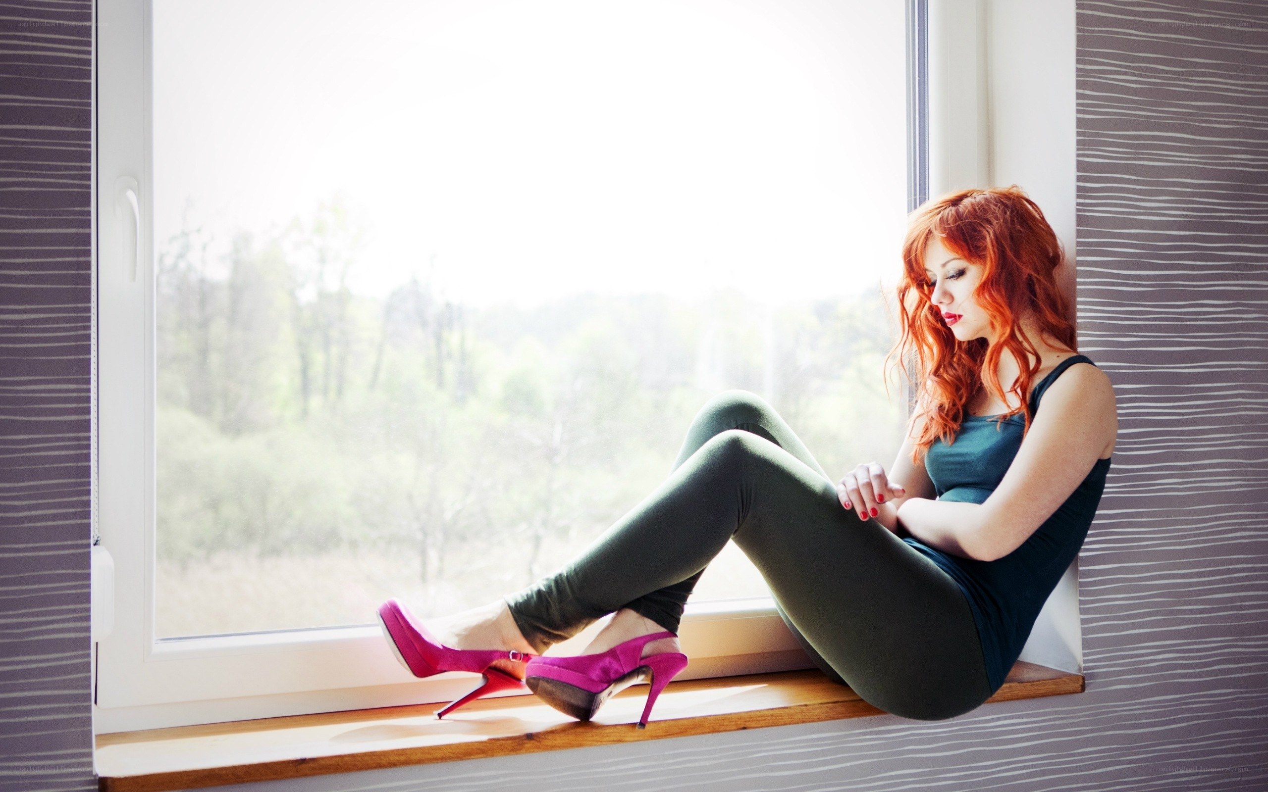 Woman in pink heels on windowsill