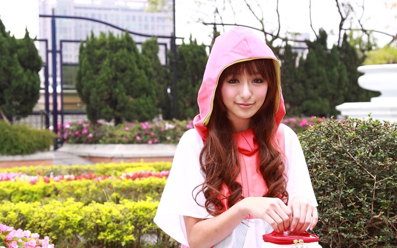 woman in pink hooded cloak