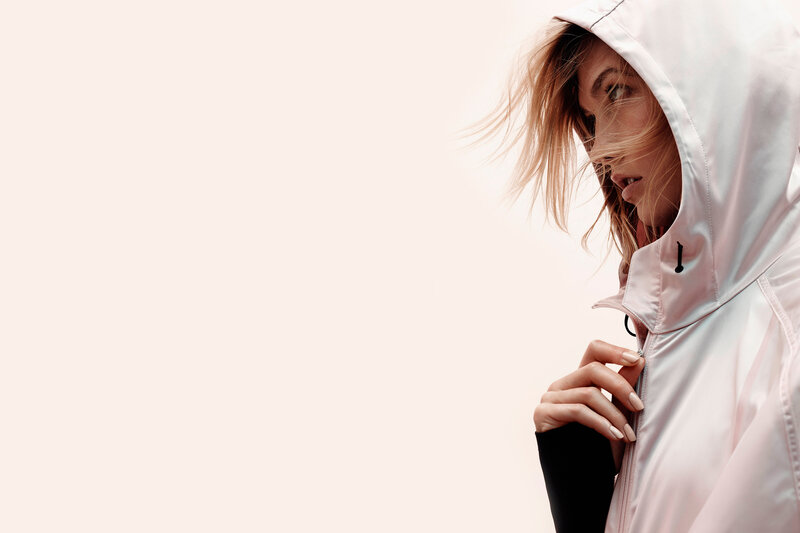 woman in pink hooded jacket
