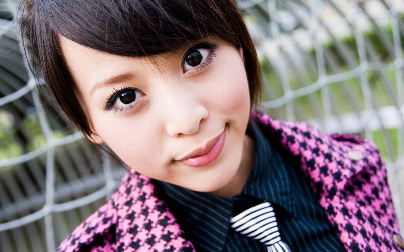 woman in pink houndstooth coat