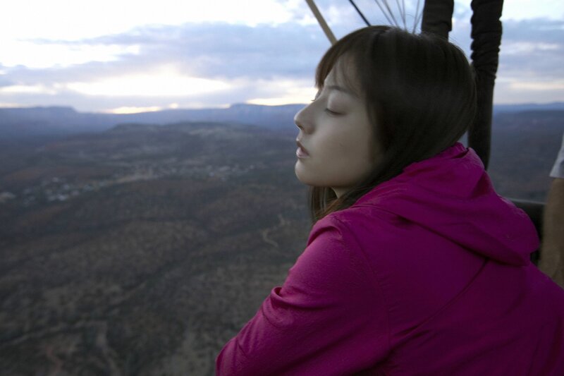 woman in pink jacket on hot air balloon