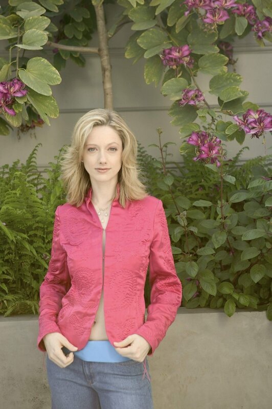 Woman in pink jacket outdoors