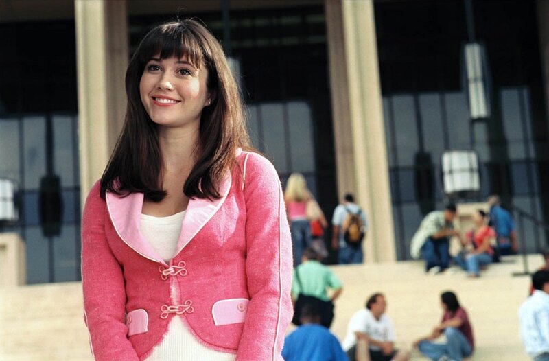 Woman in pink jacket smiling