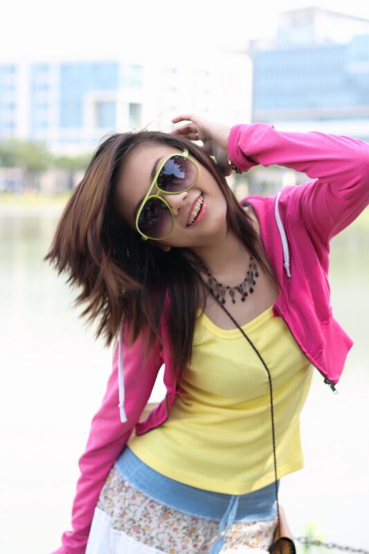 woman in pink jacket smiling