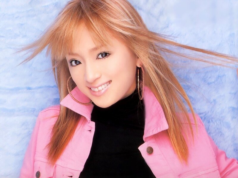 woman in pink jacket smiling