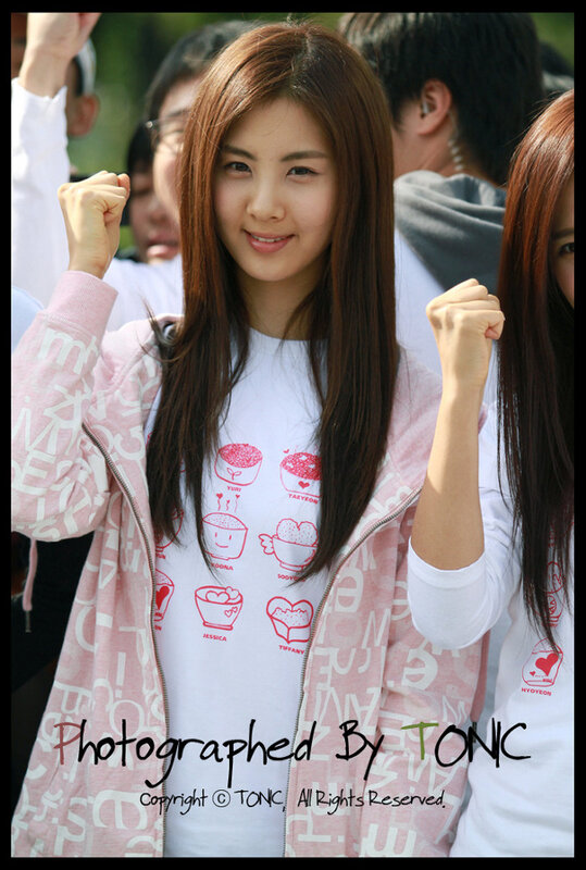 woman in pink jacket smiling