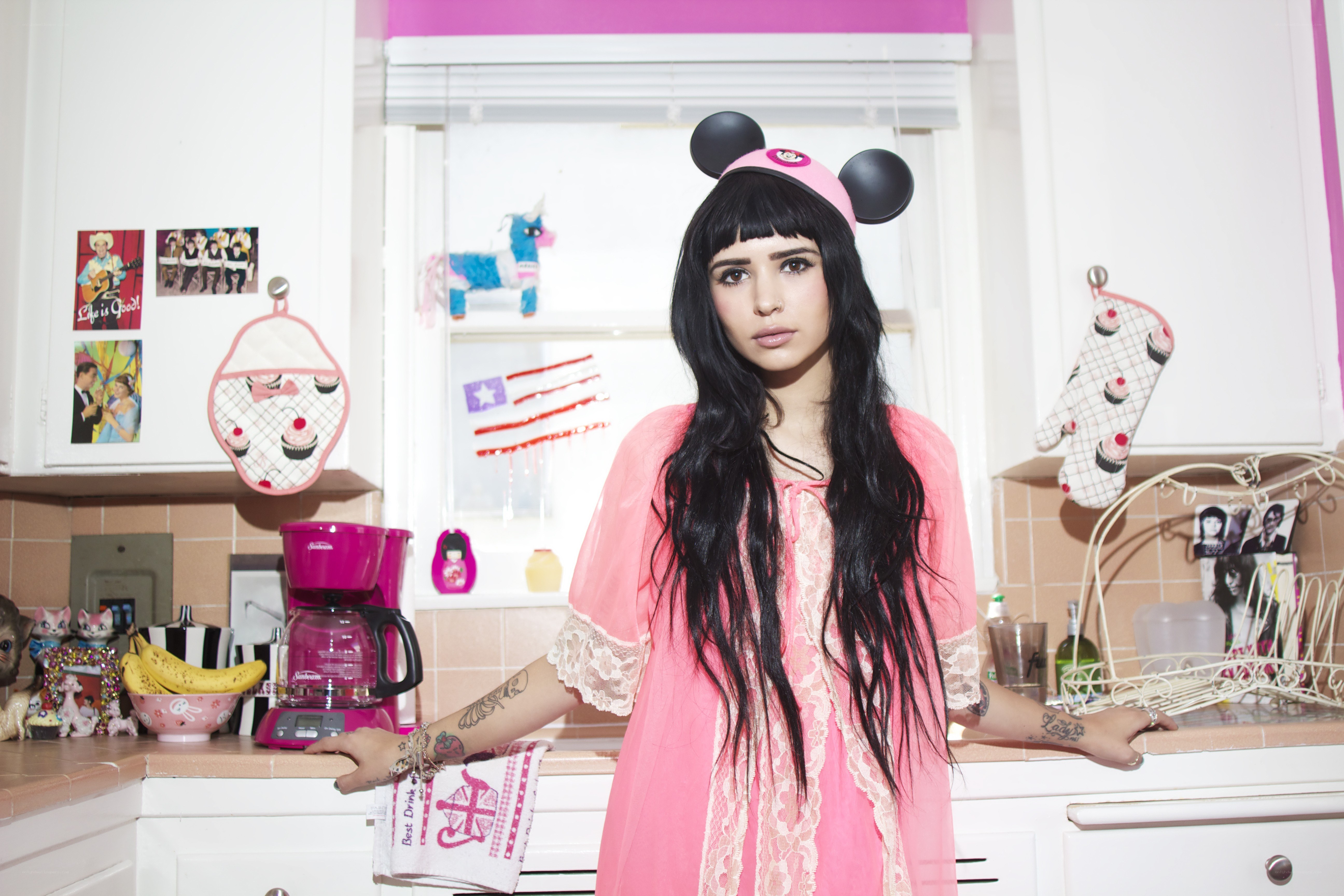 Woman in pink kitchen