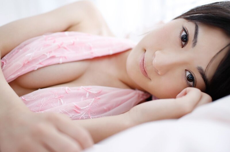 woman in pink lingerie lying down