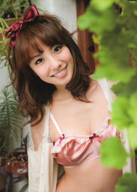 woman in pink lingerie smiling
