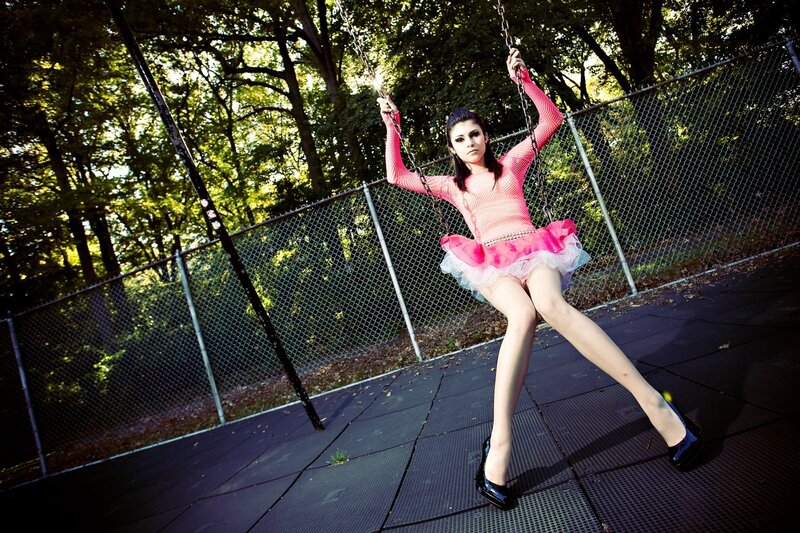 Woman in pink on a swing