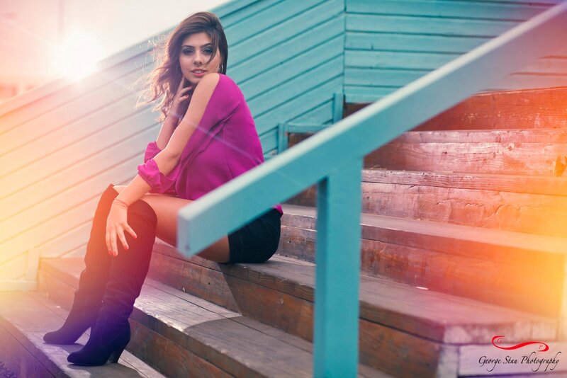 woman in pink on wooden stairs