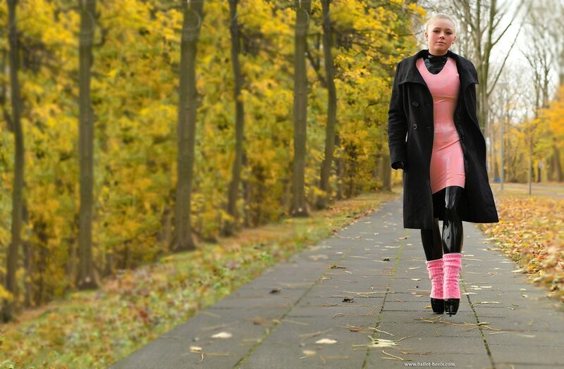 Woman in pink outfit on path
