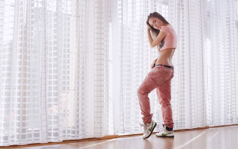 woman in pink outfit posing