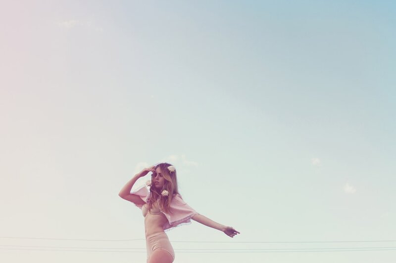 woman in pink outfit under sky