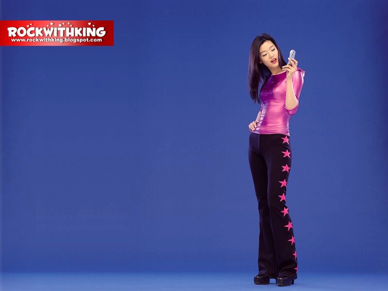 woman in pink outfit using phone