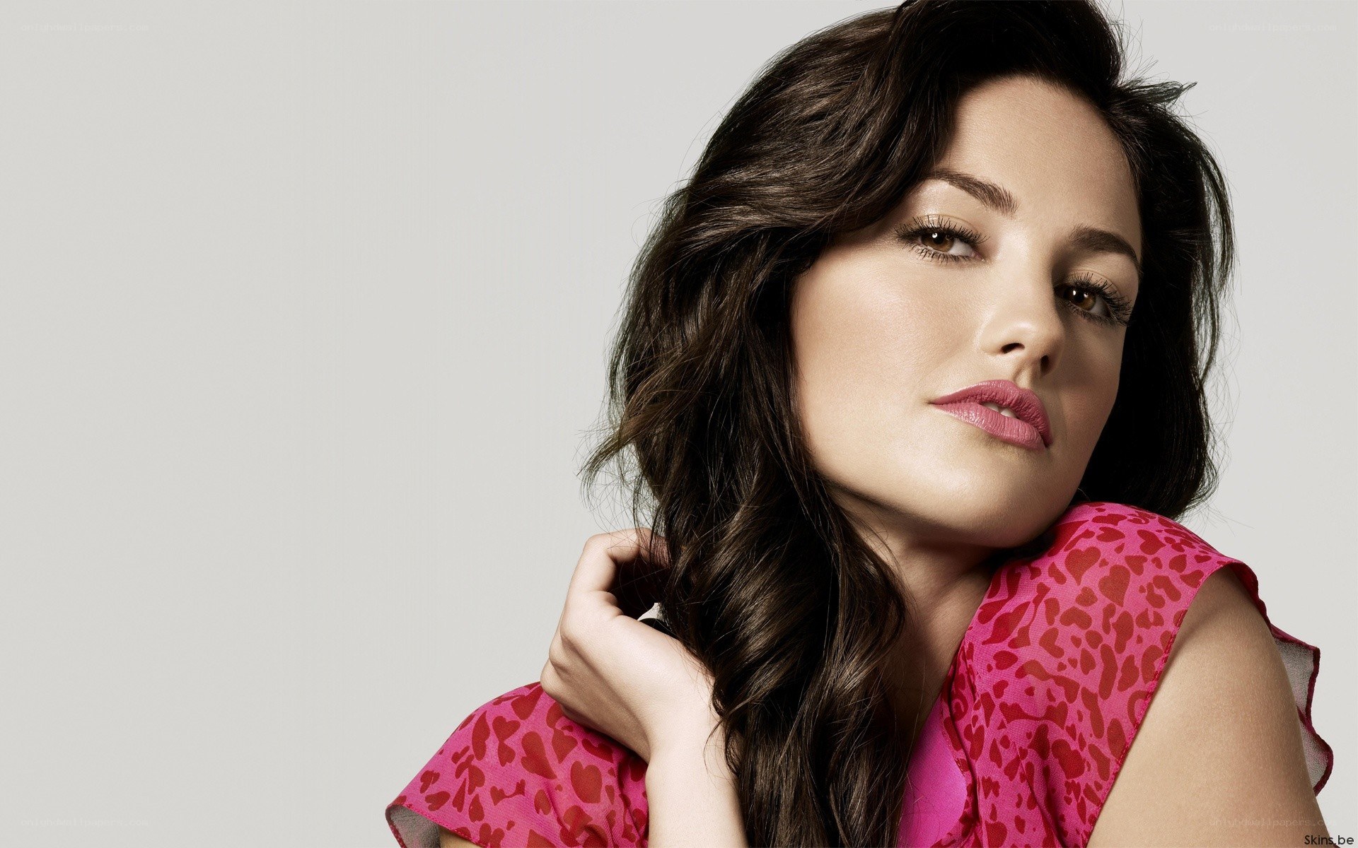 woman in pink patterned top