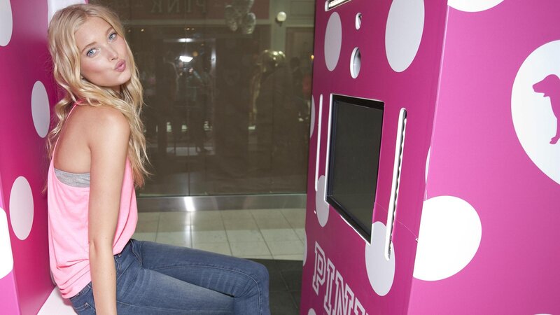 woman in pink polka-dot booth