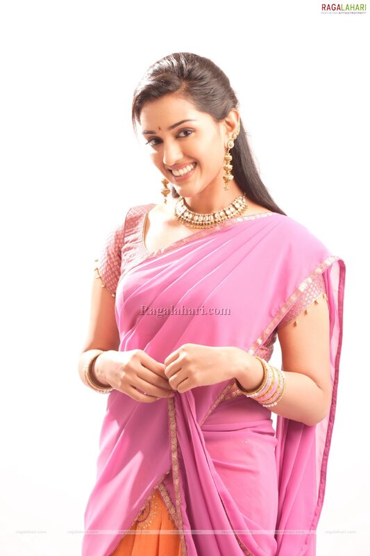 woman in pink saree smiling