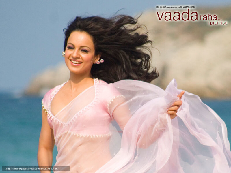 woman in pink sari at beach
