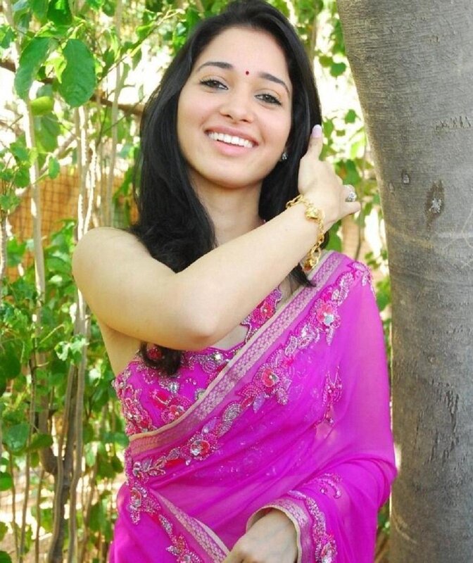 Woman in pink sari smiling