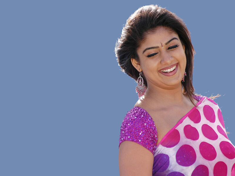 woman in pink sari smiling