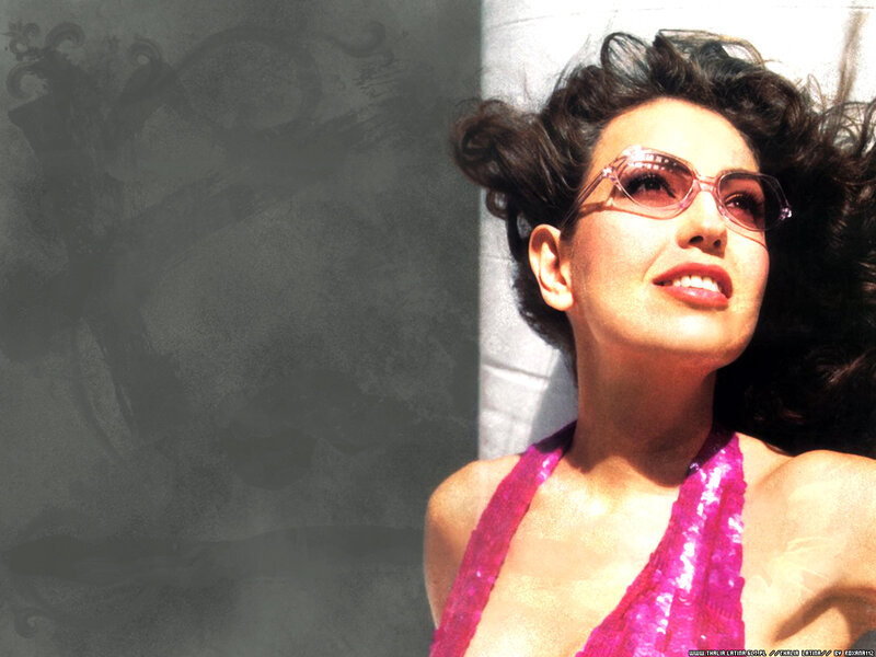 woman in pink sequins and sunglasses