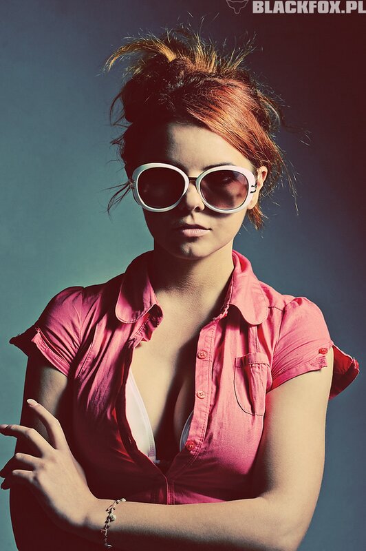 woman in pink shirt and sunglasses