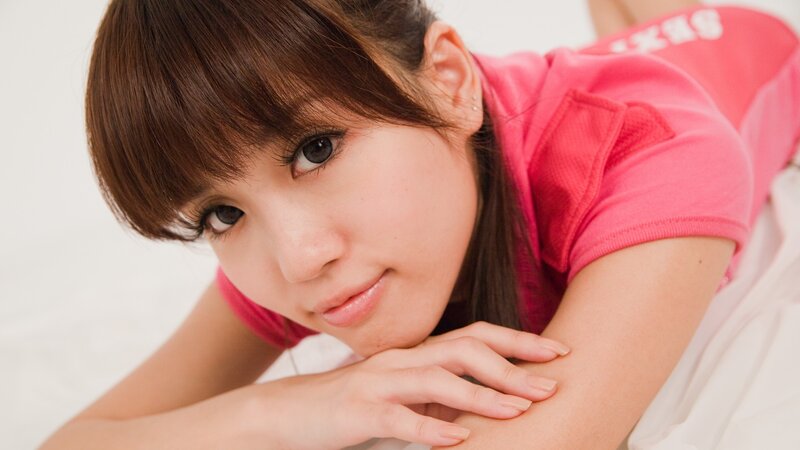 woman in pink shirt lying down