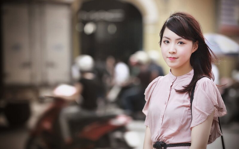 woman in pink shirt on street