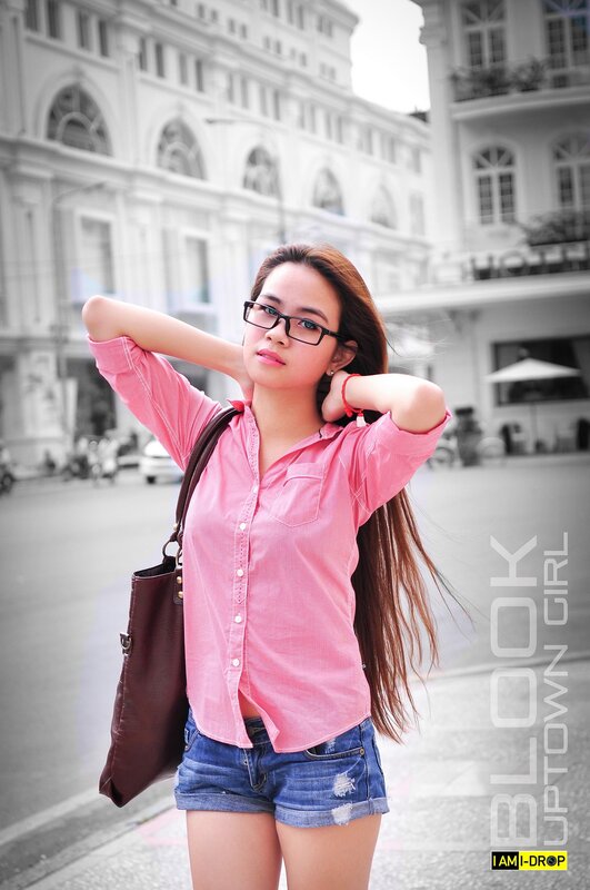 woman in pink shirt on street