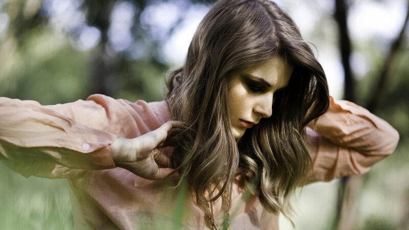 woman in pink shirt outdoors