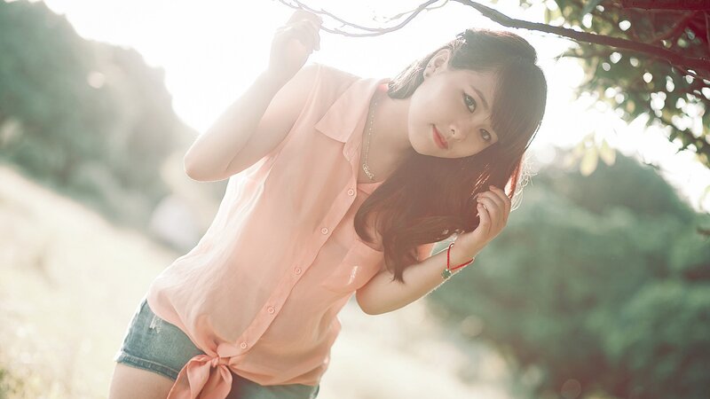 woman in pink shirt outdoors