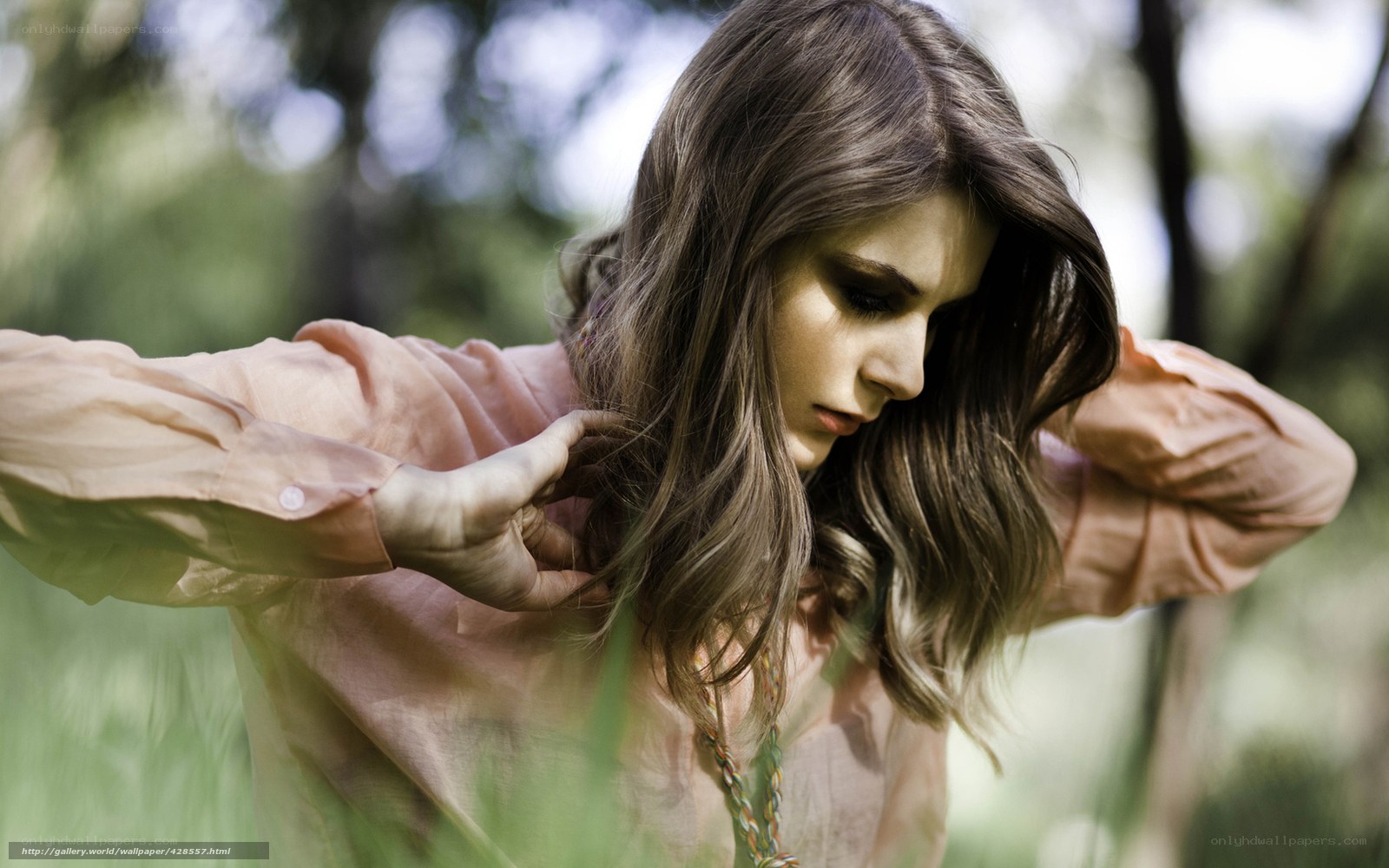 woman in pink shirt outdoors