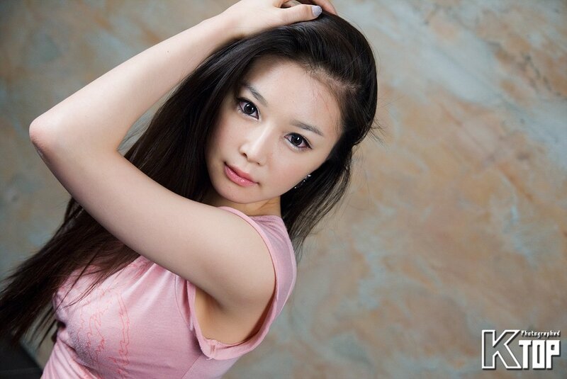 woman in pink shirt posing