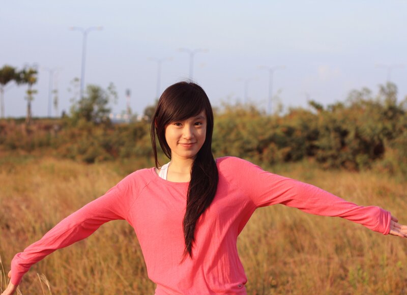 Woman in Pink Shirt — Serene, Sunset, Photograph