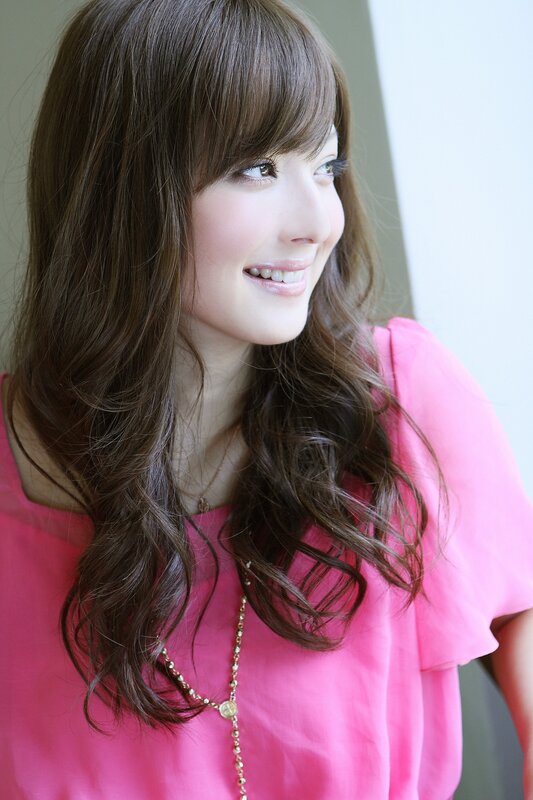 woman in pink shirt smiling