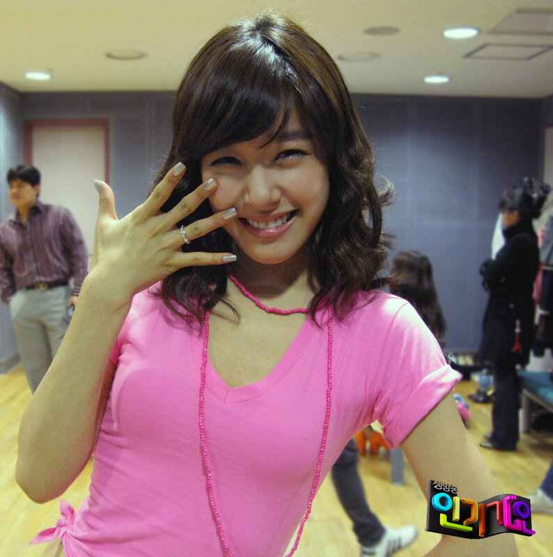 woman in pink shirt smiling