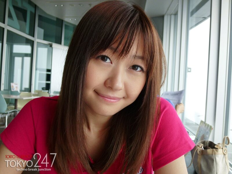 woman in pink shirt smiling