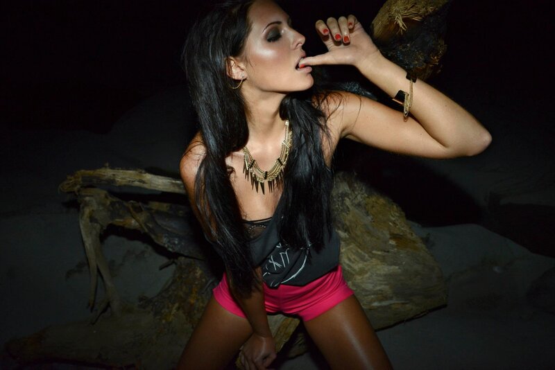 woman in pink shorts posing