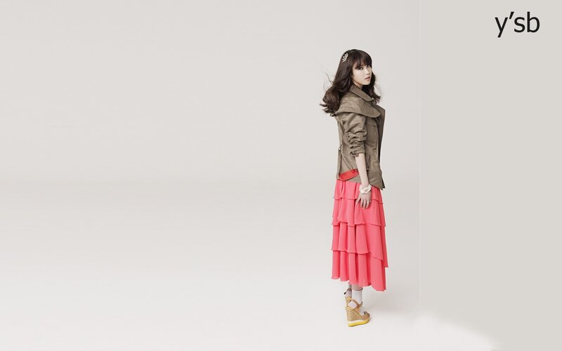 woman in pink skirt and trench coat