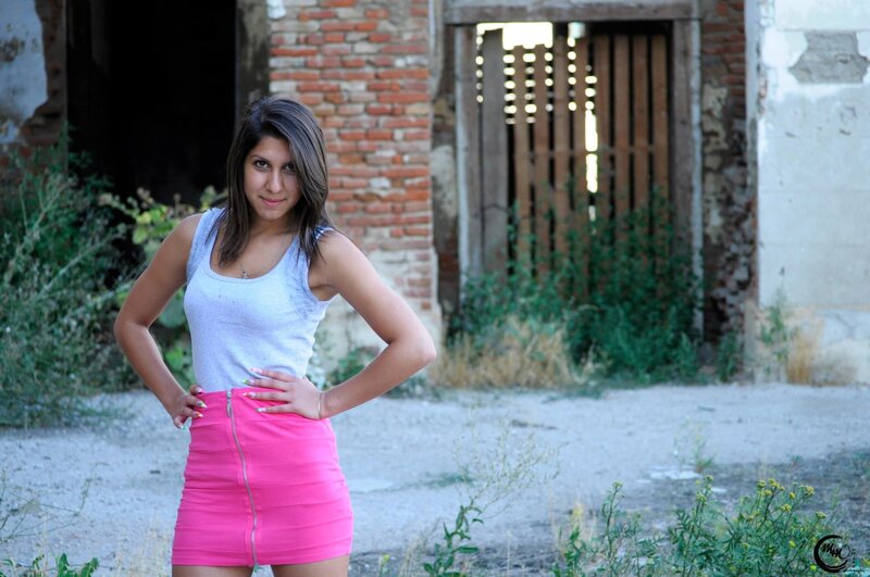 woman in pink skirt standing