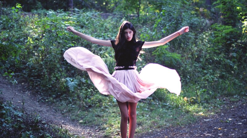 woman in pink skirt twirling