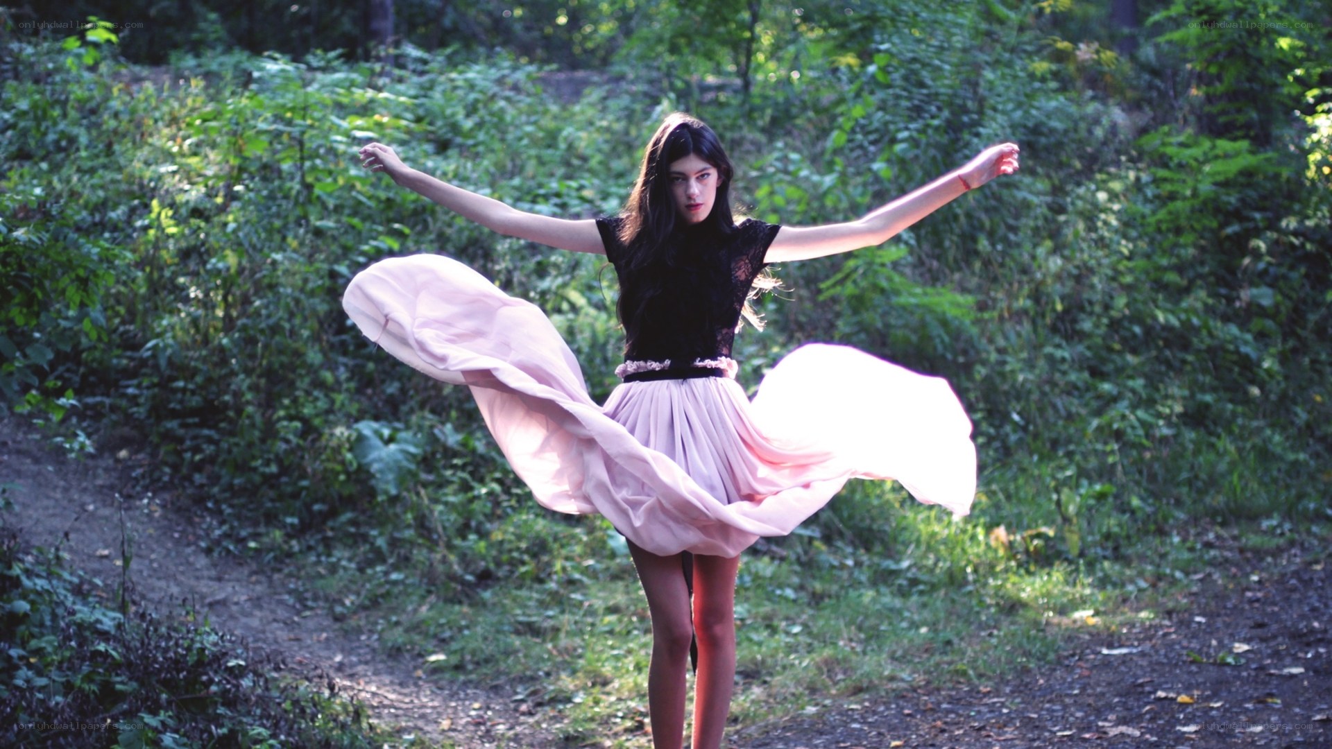 woman in pink skirt twirling