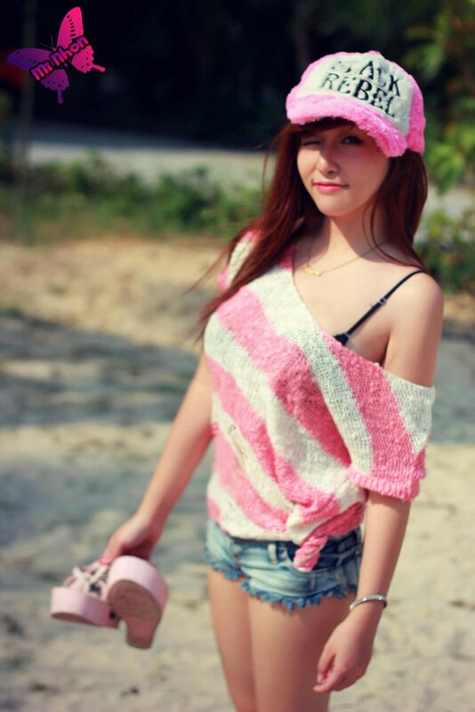 woman in pink striped sweater