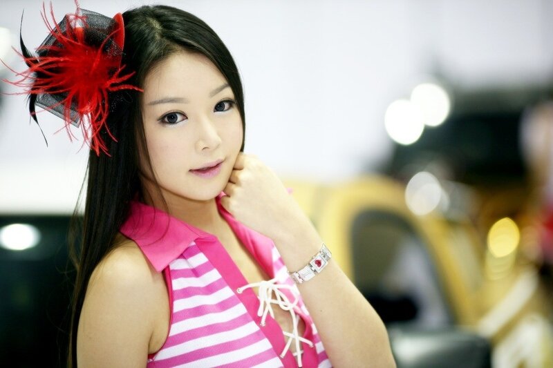 woman in pink striped top