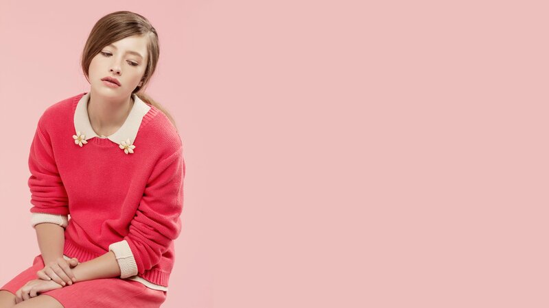 woman in pink sweater