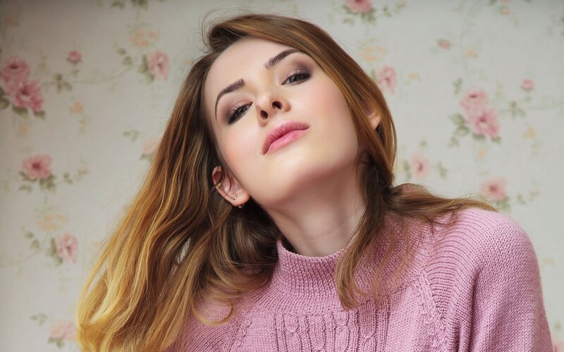 woman in pink sweater
